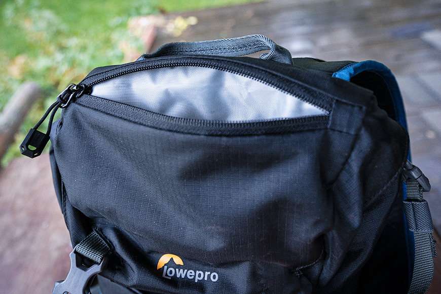 Zippered exterior top pocket