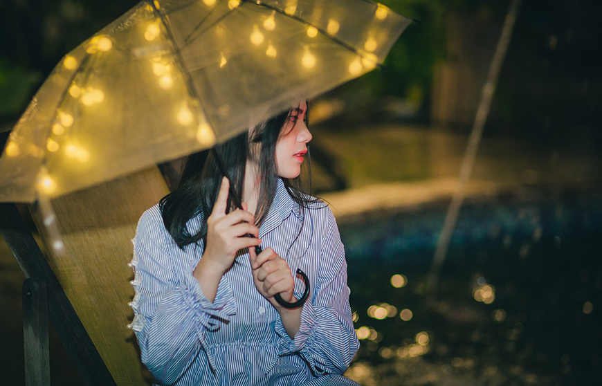 Girl with umbrella and lights