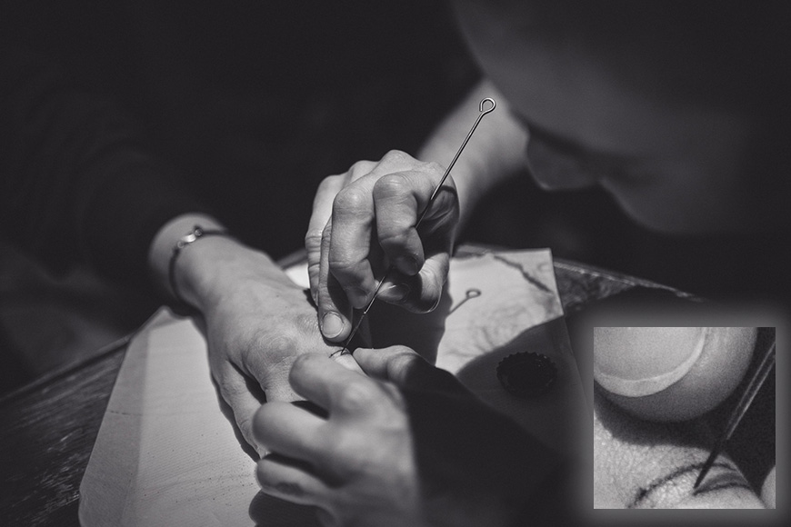 Tattoo artist in black and white, photographed with Samyang/Rokinon AF 35mm f/1.8