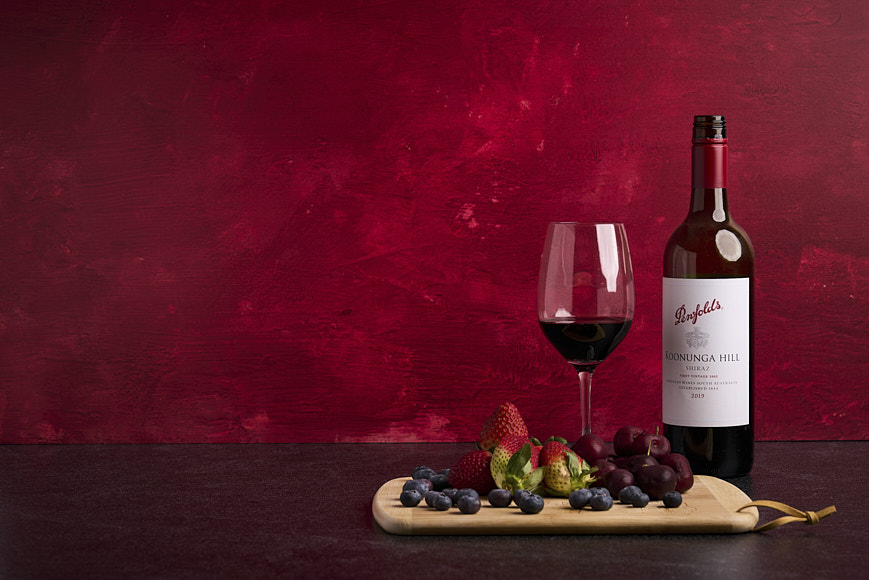 Still life photo of wine and fruit